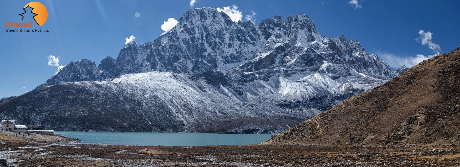 Everest Base Camp with Gokyo Lakes Trek featuring the turquoise Gokyo Lake and snow-capped Himalayan peaks in Nepal.
